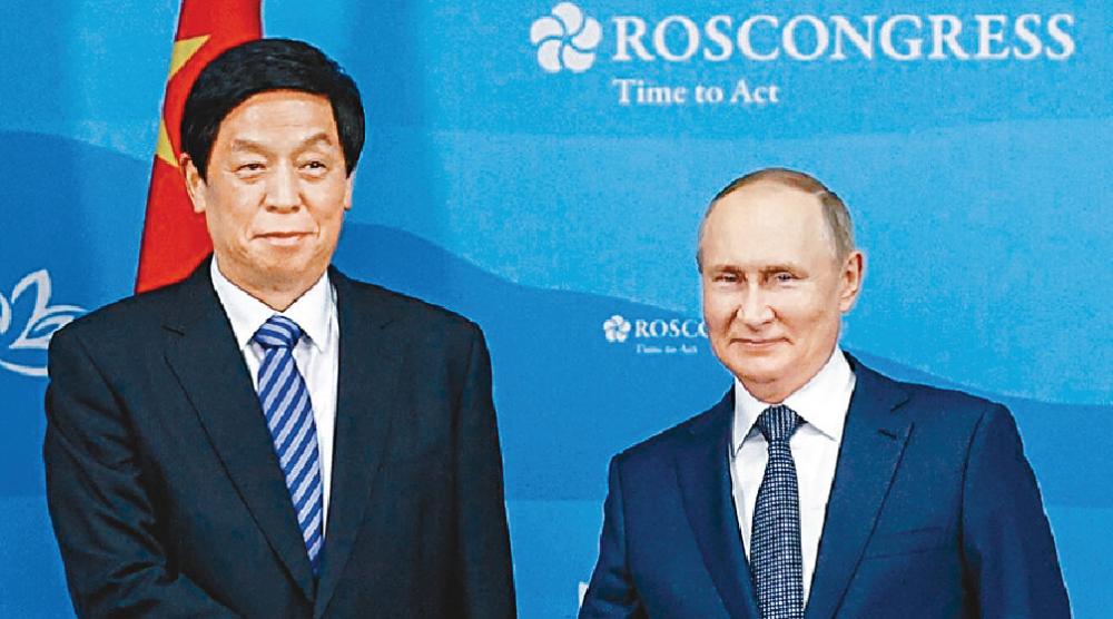 ■俄羅斯總統普京（右）與全國人大委員長栗戰書會晤。美聯社